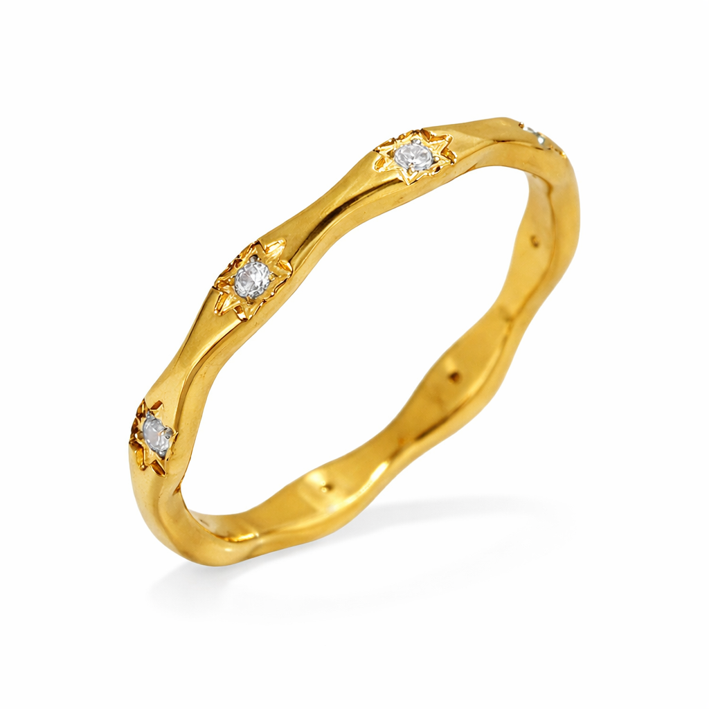 Bague Luna dorée design ondulé courbes organiques acier inoxydable fond blanc Amalys Paris